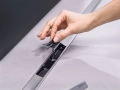 2023_CleanLine50 stainless steel brushed_in situ with hand_geberit_dam-media-large.jpg